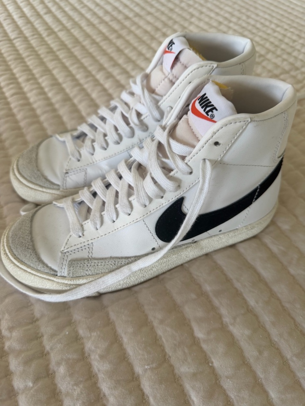 Nike White High-Top Sneakers with Black Swoosh